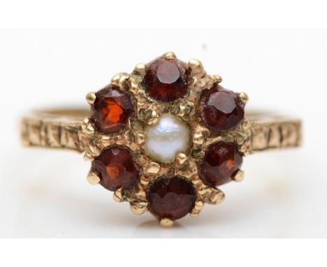 A 9ct gold garnet and pearl cluster ring, J 1/2, 2.1gm 