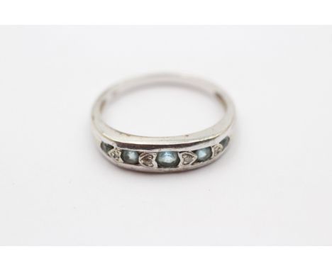 A 9ct white gold blue topaz and diamond band ring, P 1/2, 2.5gm 