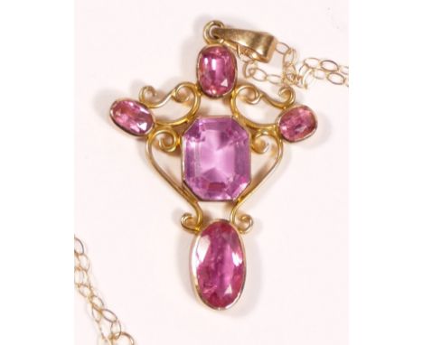 An antique gold pink tourmaline and pink paste (central stone) cross pendant, tests as 9ct gold, 42 x 25cm, chain, 4.2gm