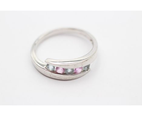 A 9ct white gold pink sapphire and topaz dress ring, T, 3.3gm 