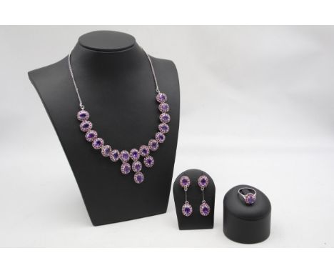 A silver, amethyst and ruby suite of necklace, ear pendants and ring, 57gm 