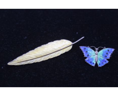 A silver and enamel butterfly brooch, 30mm and a sterling silver and yellow enamel feather brooch, 17gm 