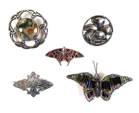 A collection of five brooches, comprising an Edwardian Scottish silver butterfly shaped brooch, decorated with red enamel, G.