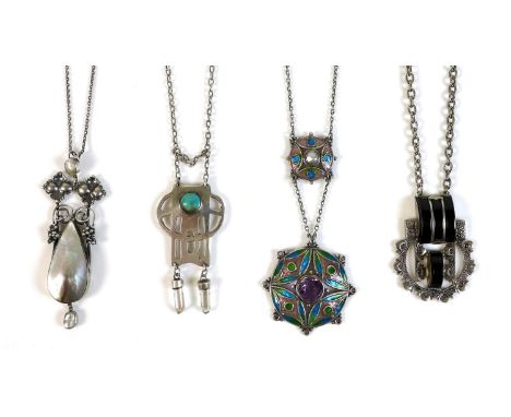 A group of four white metal Art Nouveau style and Art Deco levalier necklaces, comprising one of circular pierced pendant des