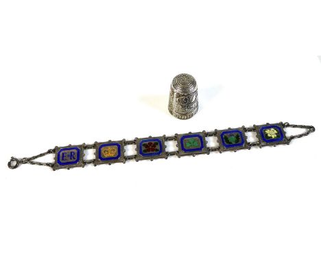 A silver six panel bracelet commemorating Queen Elizabeth II Silver Jubilee, the panels decorated with enamel and depicting E