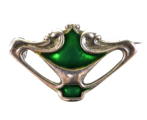 An Art Nouveau Charles Horner silver brooch, of organic pierced form, decorated with green enamel, pin fastening, Charles Hor