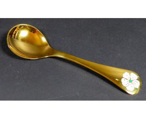 A Georg Jensen gilt Sterling silver 1971 year spoon, with enamel cherry blossom to its finial, Designed by Rigmor Anderson an