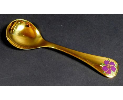 A Georg Jensen gilt Sterling silver 1974 year spoon, with enamel corn cockle to its finial, Designed by Rigmor Anderson and A