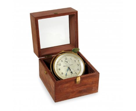 MARINE CHRONOMETER England, late 19th Century Within wooden and glass case, tilting, brass, signed by Thomas Mercer. 6.7 x 7.