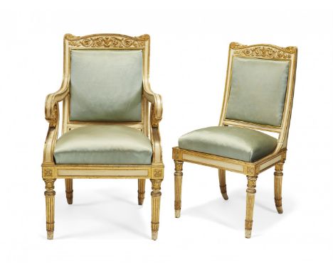 SET OF SOFA, TWO ARMCHAIRS AND TWO CHAIRS First half of 19th Century Painted gilt-wood, the sofa with feral legs and armrests