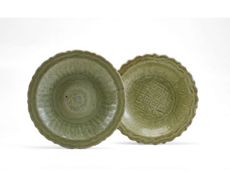 TWO LONGQUAN CERAMIC DISHES  China, Ming dynasty, 14th-15th Century Circular section with ring base, rounded walls and barbed