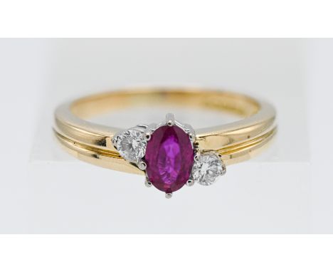 An 18ct yellow gold diamond and ruby ring, size L.