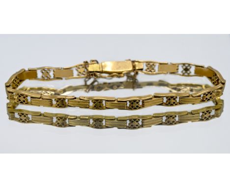 High-carat yellow gold open and bar link style bracelet with safety chain, probably 18ct, length 19cm, total weight approx. 2