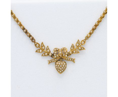 A yellow gold (probably 18ct) seed pearl lover's knot necklace, the centre knot with leaf pattern linked with fine rope chain