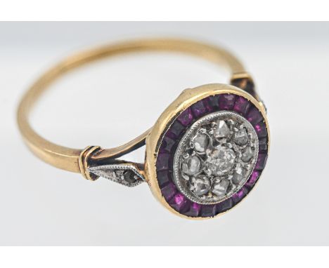 An Edwardian period ruby and diamond circle cluster ring size N.