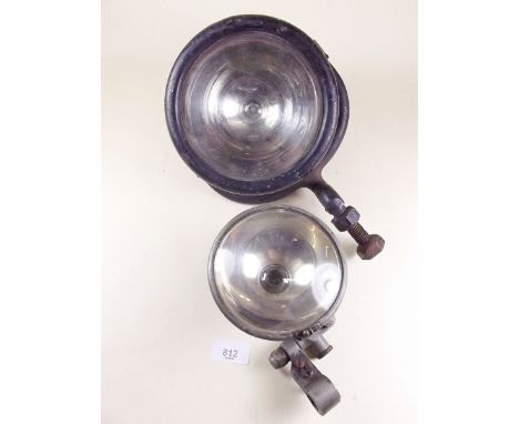 An old search light and a motorbike light