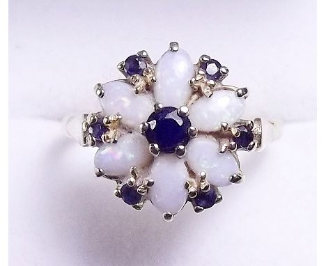 A 15 carat gold opal and sapphire cluster ring, size P and a half