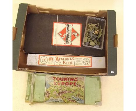 A vintage Monopoly set, a Touring Europe game, kite etc