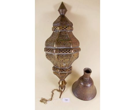 An Eastern brass hanging lantern with pierced decoration (the lantern 52cm long) and a brass hookah base