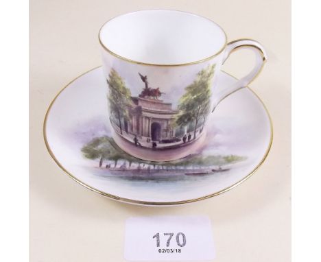 A Royal Worcester coffee can and saucer painted 'The Arch, Hyde Park Corner' and 'St Pauls Cathedral' signed Davis