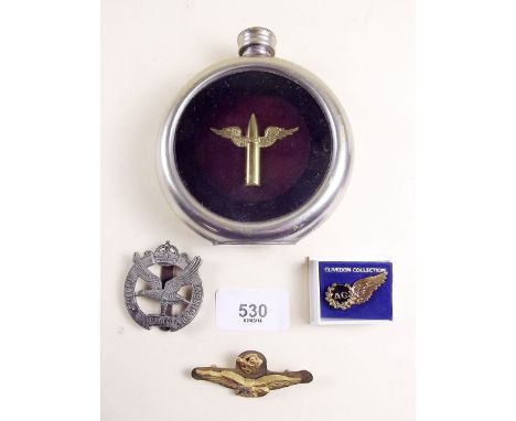 A glider pilot cap badge, RAF badge, a later pin and spirit flask