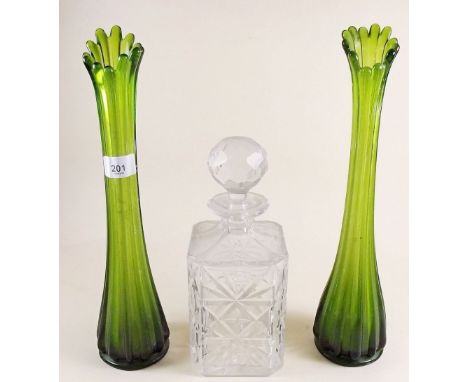 A pair of Edwardian green lustred glass vases and a cut glass decanter
