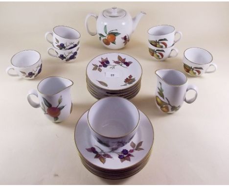 A Royal Worcester Evesham tea service comprising six cups and saucers, two jugs, six tea plates and sugar