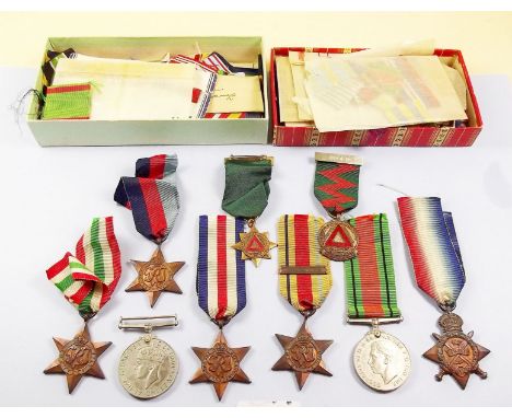 A Collection of WW2 medals , a box of ribbons and two safe driving medals