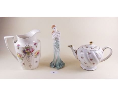 A Sadlers teapot printed roses, a Crown Devon jug a/f and a Coalport figure 'Emerald'