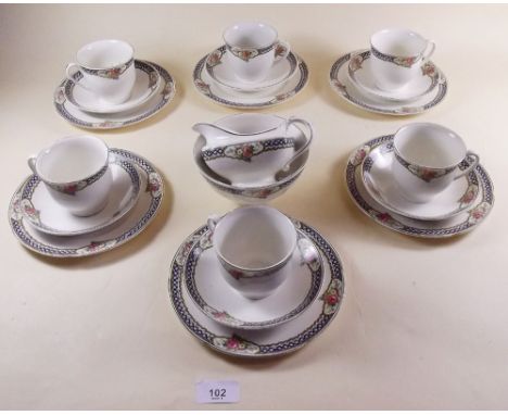 A Grindley tea service comprising six cups and saucers, six tea plates, milk and sugar
