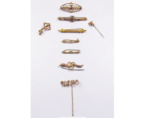 Six 9 carat gold bar brooches, one yellow metal brooch and two stick pins