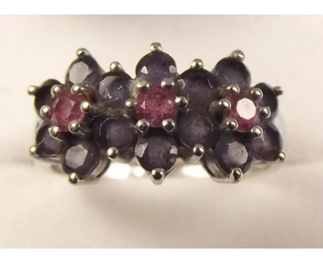 A 14k gold sapphire and ruby triple cluster ring, size S