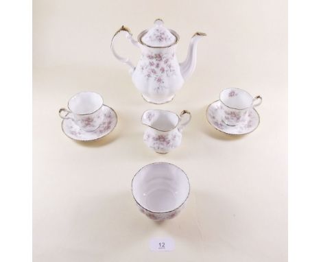 A Paragon Victorian Rose coffee set comprising six cups and saucers, milk, sugar and coffee pot