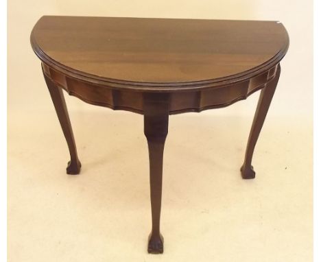 A South African Stinkwood console table on slender claw and ball supports