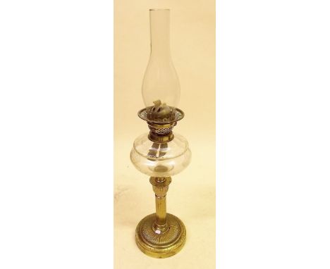A Victorian brass oil lamp with cut glass reservoir