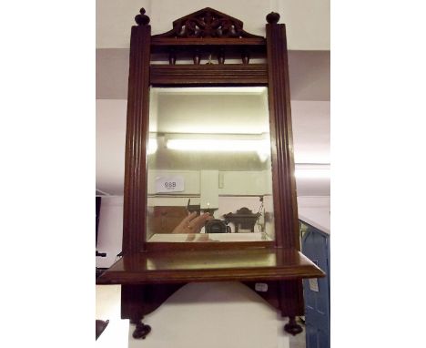 An Edwardian mahogany hall wall mirror with shelf
