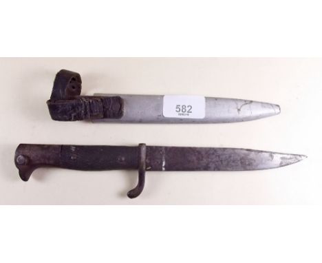 A WWI German trench knife with eagle handle and metal scabbard