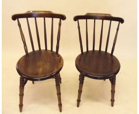 A pair of early 20th century beech stick back chairs