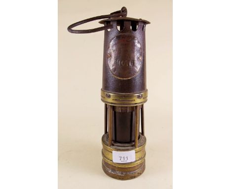 An antique miners safety lamp