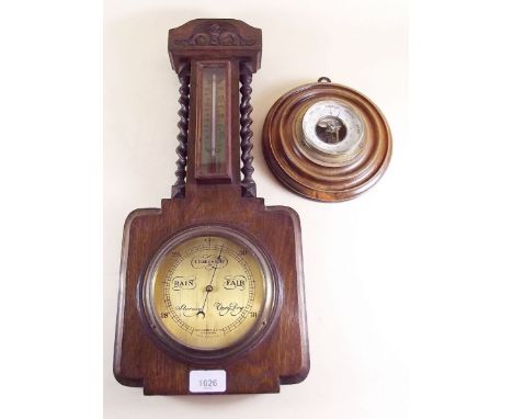 An oak cased barometer by John Baker and a German circular barometer