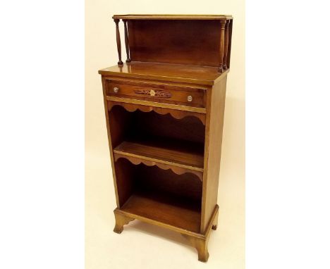 A small Edwardian style stained pine cabinet with display shelf over inlaid drawer and shelves