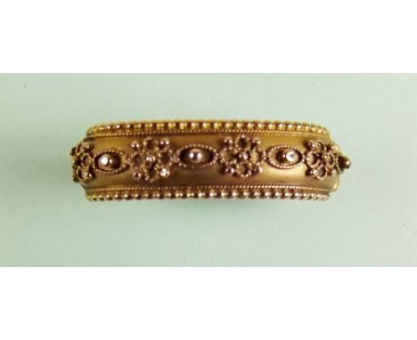 A Victorian 9 carat gold scarf clip with filigree decoration