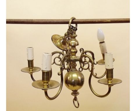 A Dutch style brass light fitting and three wall lights