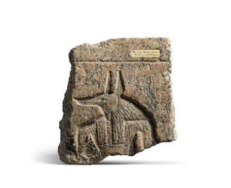 An Egyptian pink granite sarcophagus fragment with the head of Anubis or WepwawetNew Kingdom, circa 1550-1069 B.C.24cm high, 