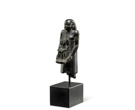 A small Egyptian steatite theophorous figure, holding a seated statuette of ImhotepLate Period, 27th-30th Dynasty, circa 525-
