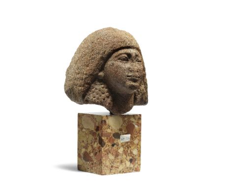 An Egyptian red quartzite male head of a statueNew Kingdom, 18th Dynasty, circa 1550-1292 B.C.13.5cm high Footnotes:Provenanc