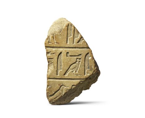 An Egyptian limestone relief fragment with hieroglyphic inscriptionOld Kingdom, circa 2323-2150 B.C. or Archaising Late Perio