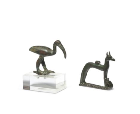 A small Egyptian bronze striding ibis and an Egyptian amuletic bronze figure of WepwawetLate Period-Ptolemaic Period, circa 6