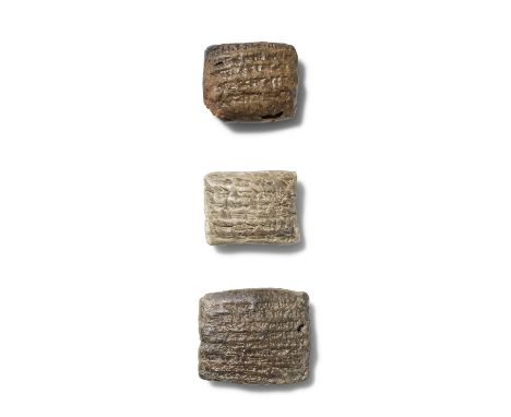 Three Babylonian and Neo-Babylonian terracotta cuneiform tabletsCirca 6th Century B.C.The smallest pale grey terracotta Babyl