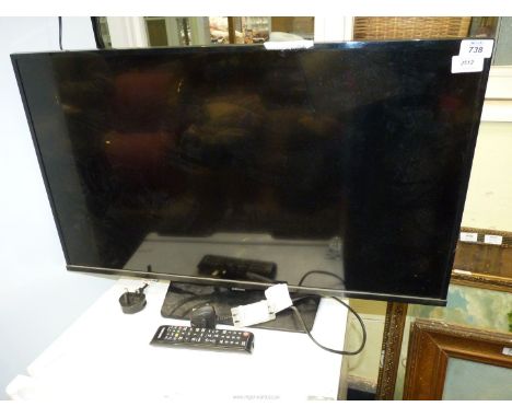 A "Samsung" 32" TV with remote.